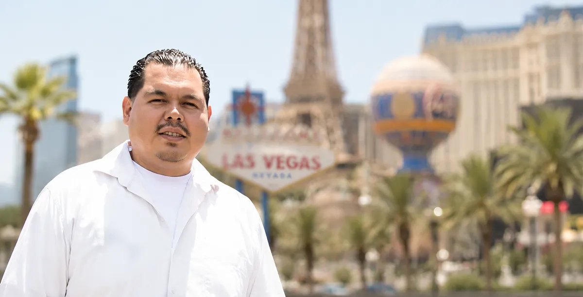 Juan Avilez, Systems Architect at Padrino, in front of the Las Vegas Strip